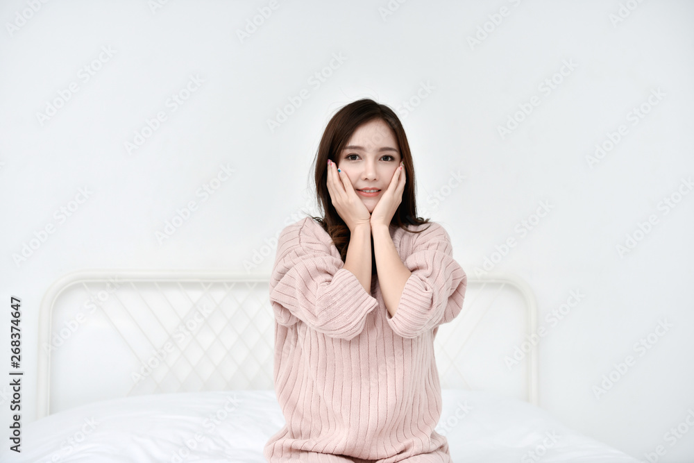 Relaxation concept. The beautiful girl is smiling happily inside the room. Beautiful Asian girl smiling cute and charming. Relaxation concept. The beautiful girl is smiling happily inside the room. Beautiful Asian girl smiling cute and charming.