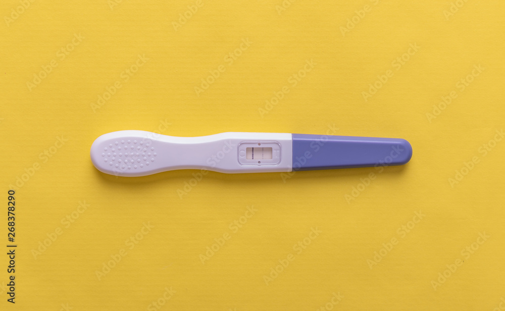 Pregnancy test on yellow background. Pregnancy test on yellow background.