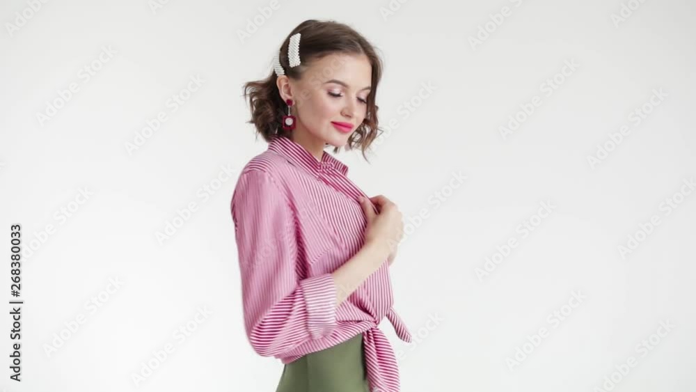 Beautiful girl in unbuttoned shirt on white background posing in Studio, cyclorama Beautiful girl in unbuttoned shirt on white background posing in Studio, cyclorama