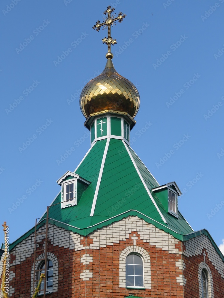 Golden dome of the brick church in Chuvashia Golden dome of the brick church in Chuvashia