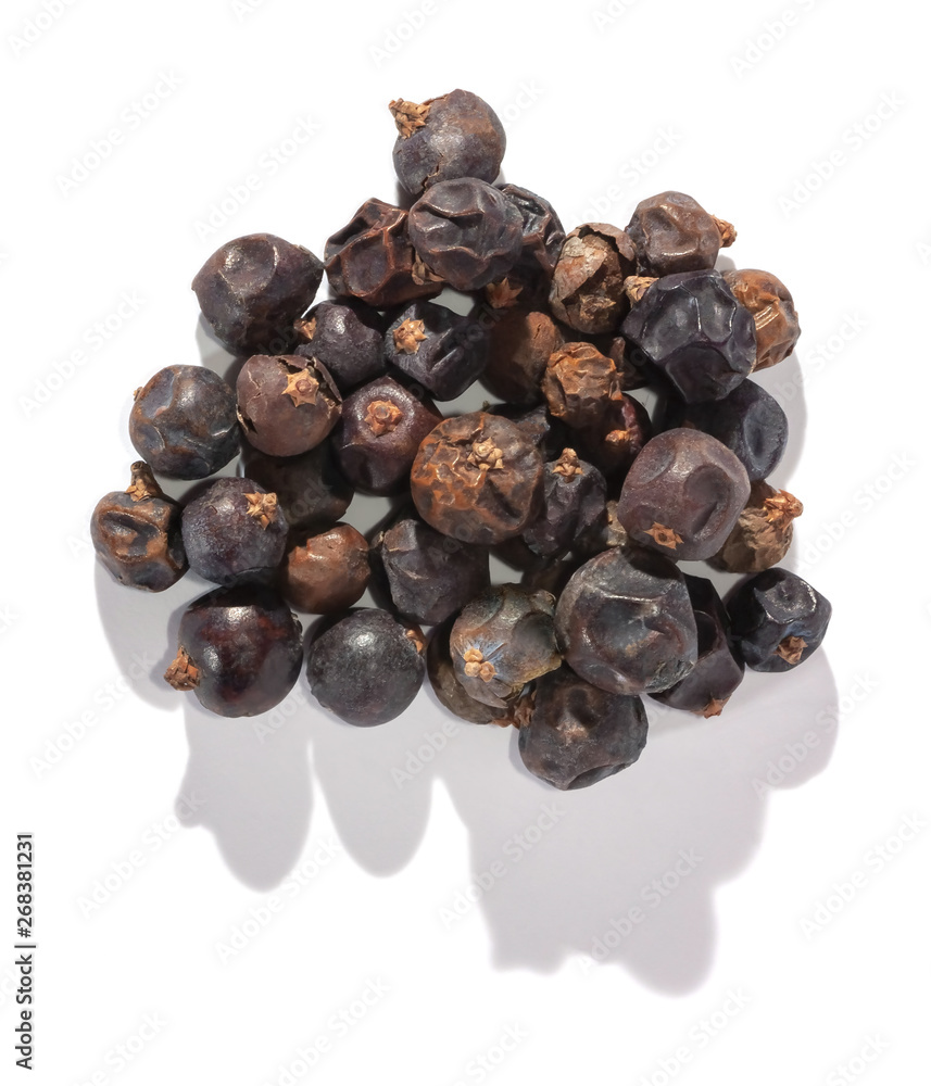 Dried juniper berries isolated on white. Soft focus view. Close up. Dried juniper berries isolated on white. Soft focus view. Close up.