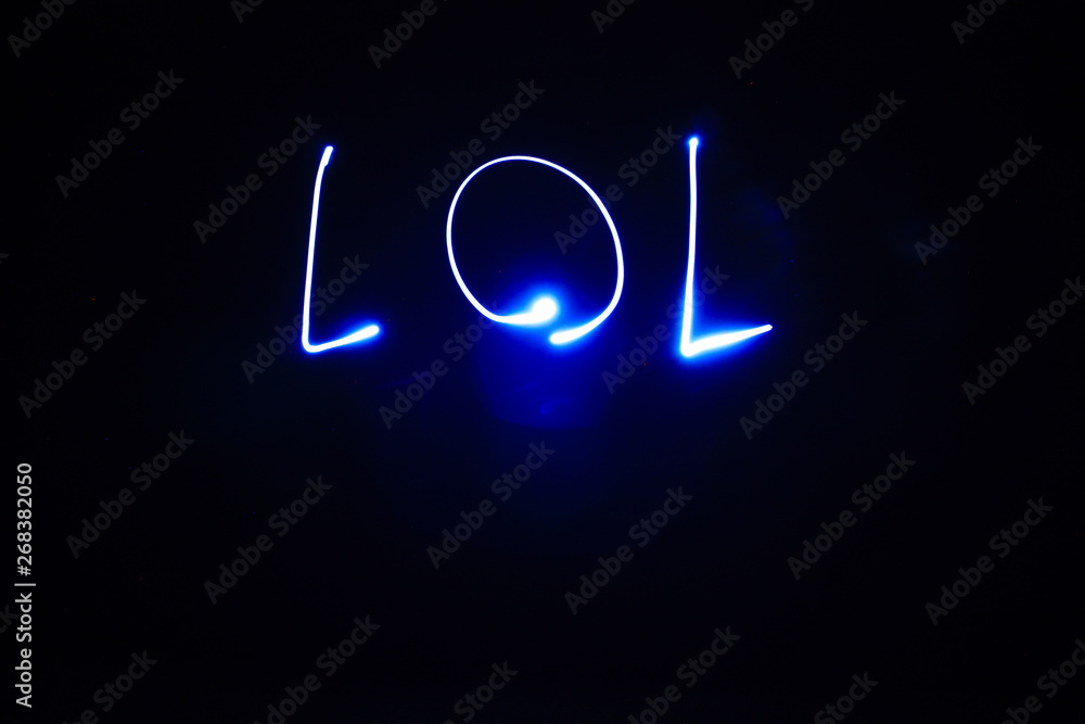 Word lol written with streaks of light led at lightpainting. Blue neon with  black background Stock Photo | Adobe Stock
