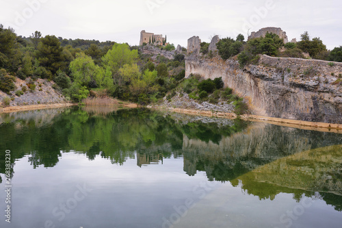 View of castle ruins and lagoon in St Saturnin les Apt, France