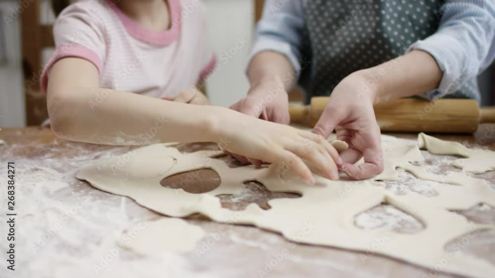 family lay-up baking cookies on the baking sheet to cook it with flow camera family lay-up baking cookies on the baking sheet to cook it with flow camera