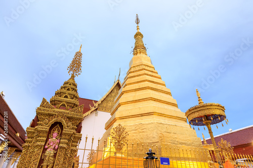 Tableau sur toile Golden pagoda for year of tiger at  Wat Prathat Cho Hae Temple in Phrae province