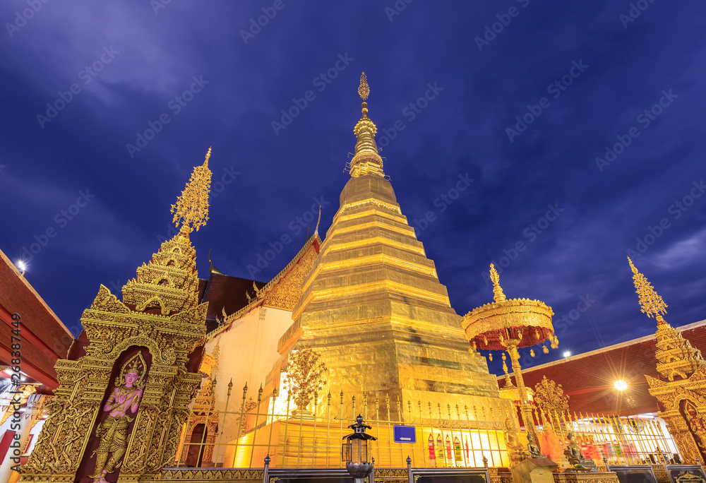 Fototapeta premium Golden pagoda for year of tiger at Wat Prathat Cho Hae Temple in Phrae province, north of Thailand