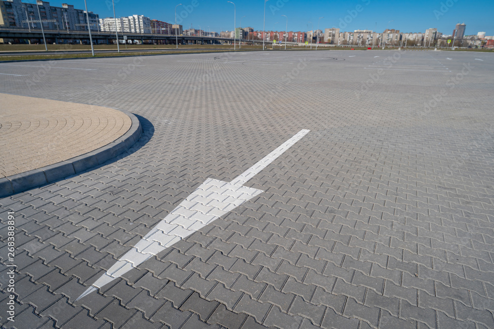 Fototapeta premium Open space with road signs and road markings, road intersections, pedestrian crossings, sunny day, blue sky, city landscape background