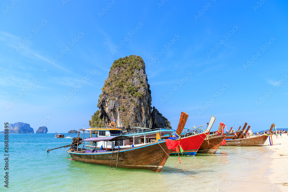 Beautiful clear turquoise blue sea and boats at Ao Phra Nang near Railay beach, Krabi, Thailand Beautiful clear turquoise blue sea and boats at Ao Phra Nang near Railay beach, Krabi, Thailand