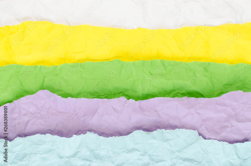 Background made of strips of crumpled paper of different colors Background made of strips of crumpled paper of different colors