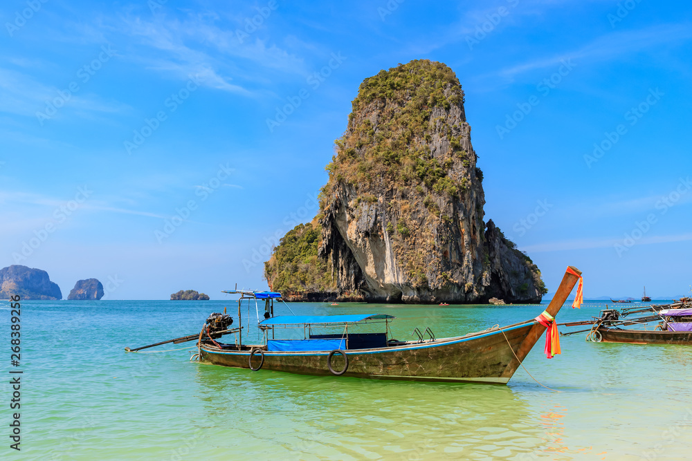 Beautiful clear turquoise blue sea and boats at Ao Phra Nang near Railay beach, Krabi, Thailand Beautiful clear turquoise blue sea and boats at Ao Phra Nang near Railay beach, Krabi, Thailand