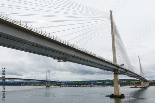 The new Queensferry Crossing bridge over the Firth of Forth with the older Forth Road bridge in Edinburgh Scotland.