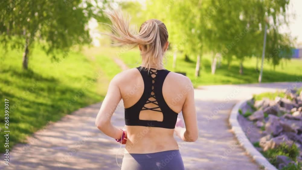Girl doing morning run in the park early in the morning Girl doing morning run in the park early in the morning