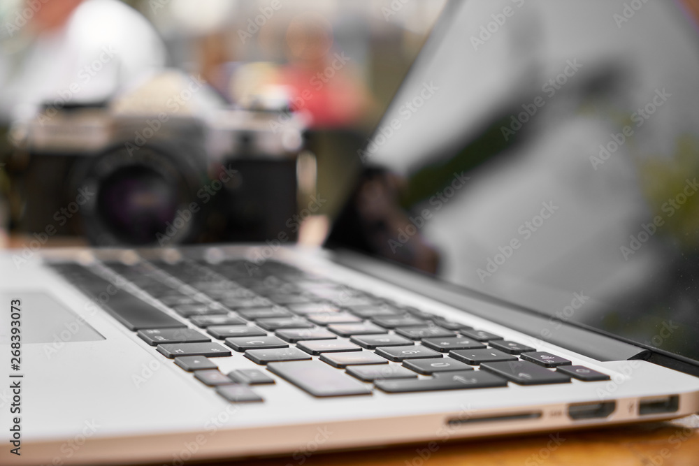 laptop and retro camera on the table