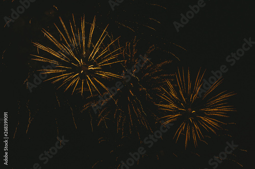 Wallpaper Mural Close-up gold festive fireworks on a black background. Abstract holiday background Torontodigital.ca