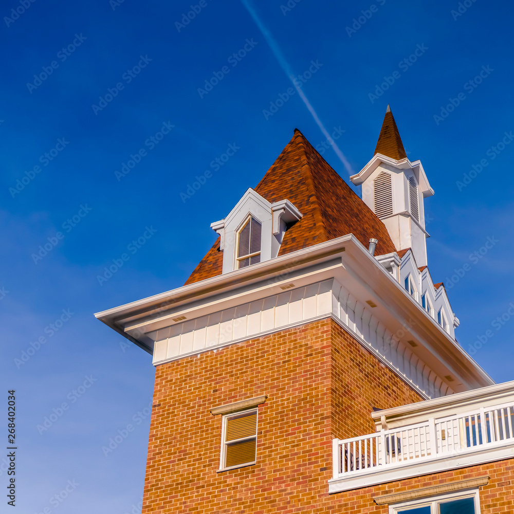 Clear Square Exterior view of a building against vibrant blue sky on a bright sunny day