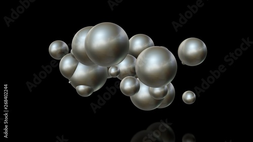 3D illustration of metal balls of different sizes randomly arranged in space and penetrating into each other. A futuristic image, an abstraction. 3D rendering isolated on black background.