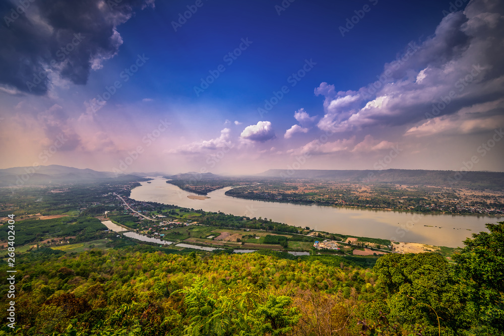 Top view of border near Mekong river with mountain and cloudy sky and tree from NongKai, Thailand