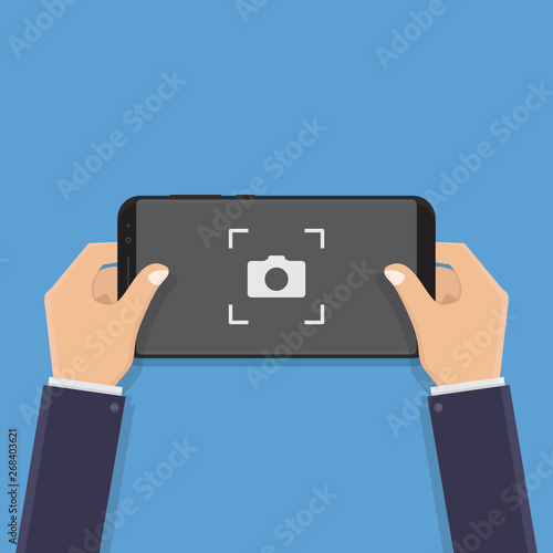 Hand holding smart phone, take pictures, flat design vector illustration