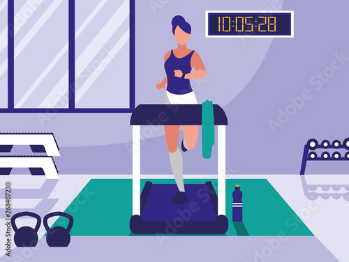 woman with runner machine in gym