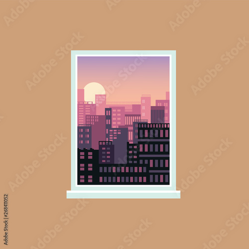 Window view of sunset over modern city, urban architecture and house exteriors seen from inside a room