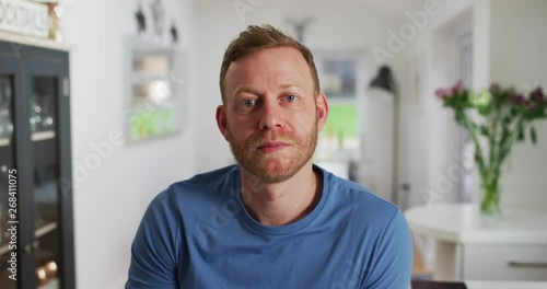 4K Man trying to look interested, listening to boring conversation on video call
