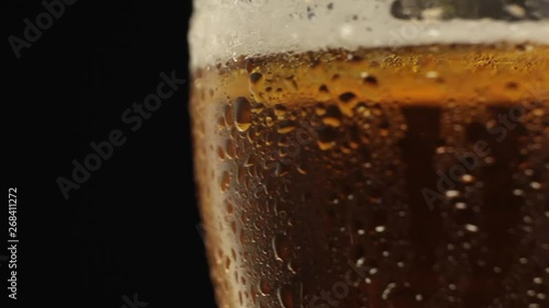 Wallpaper Mural Beer glass with beer close-up. A glass of cold light beer with drops of water on the glass Torontodigital.ca