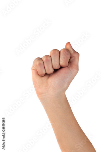Woman hand with fingers folded into a fist on whte background