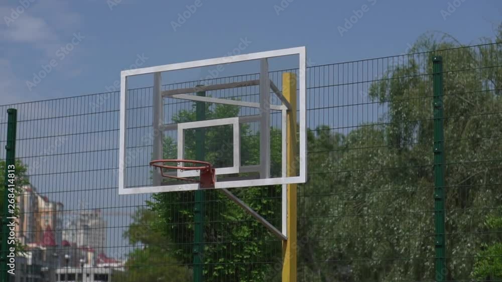 Basketball hoop on a playground in a city park. Close-up. Camera movement Basketball hoop on a playground in a city park. Close-up. Camera movement