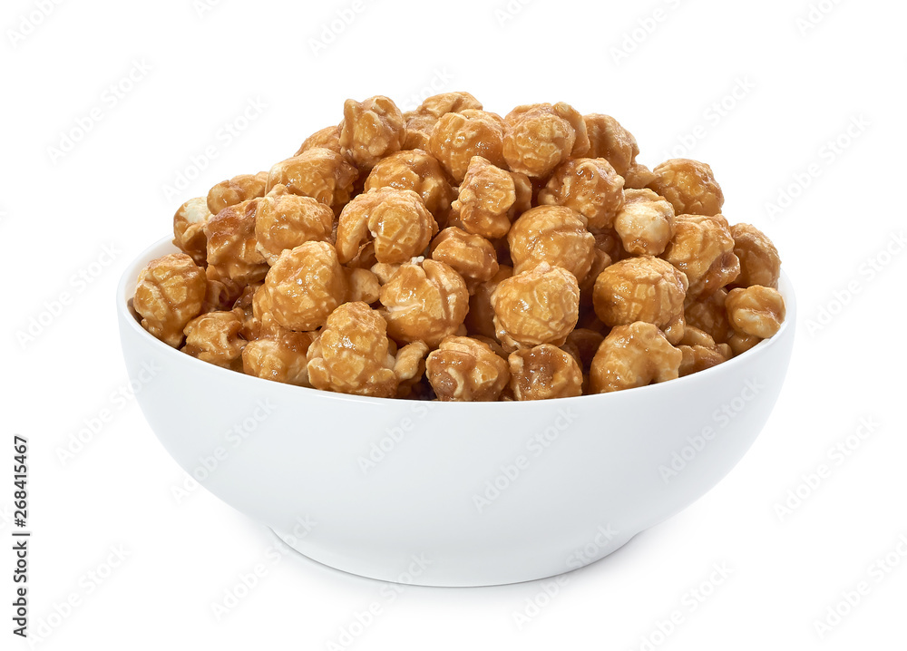 Caramel popcorn in white porcelain bowl isolated on white background. Including clipping path. Caramel popcorn in white porcelain bowl isolated on white background. Including clipping path.