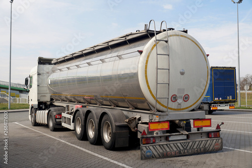 A truck with a tanker designed to transport food products. Long vehicle.
