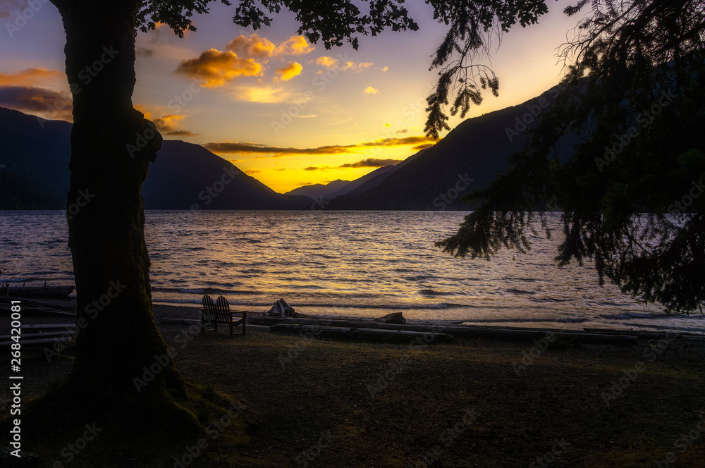Lake Crescent scenery. Sunset over the lake and the mountain range. Olympic National Park or Peninsula, Washington state, USA. Lake Crescent scenery. Sunset over the lake and the mountain range. Olympic National Park or Peninsula, Washington state, USA.