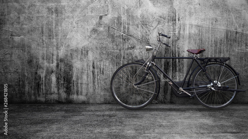 Retro vintage black bike on old brick wall. © Fernando