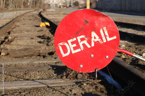 Konstfotografi Red derail warning symbol sign on old abandoned railroad tracks