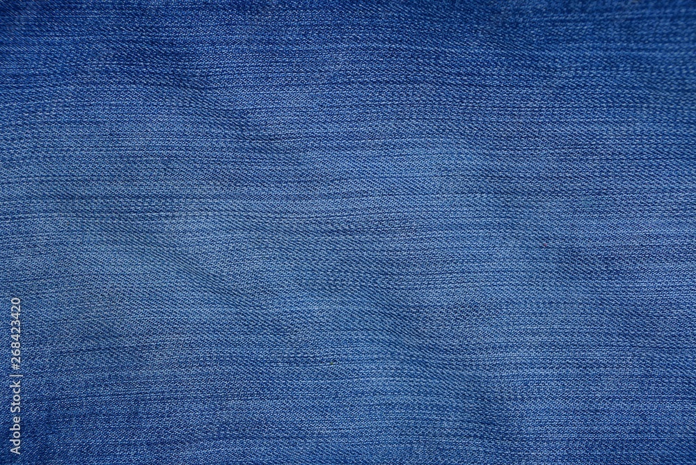 blue fabric texture of mashed and shabby denim on pants blue fabric texture of mashed and shabby denim on pants