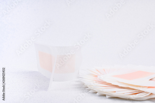 Wax strips for hair removal on a white background. Spa and beauty treatments. Free space for text. Copy space.