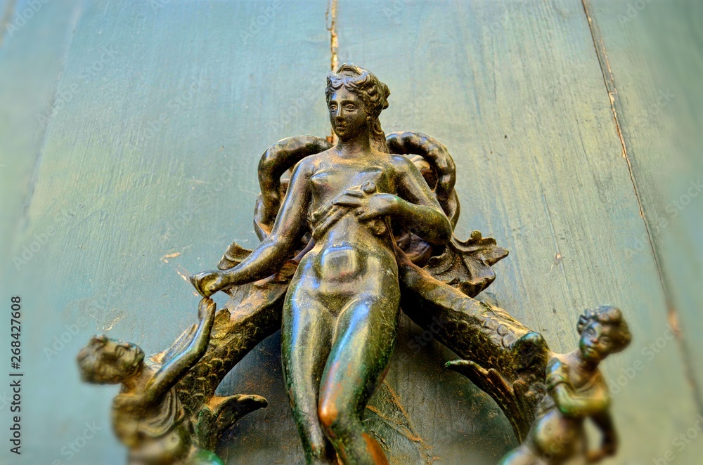 part of the unusual door handle in the form of a female figure