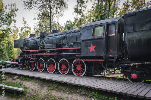 Old steam locomotive with Soviet star in regional promotion park in Szymbark, Poland