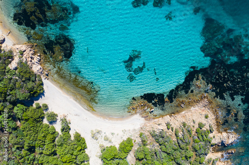 View from above  stunning aerial view of the Capriccioli Beach bathed by a beautiful turquoise sea. Costa Smeralda  Emerald Coast  Sardinia  Italy.