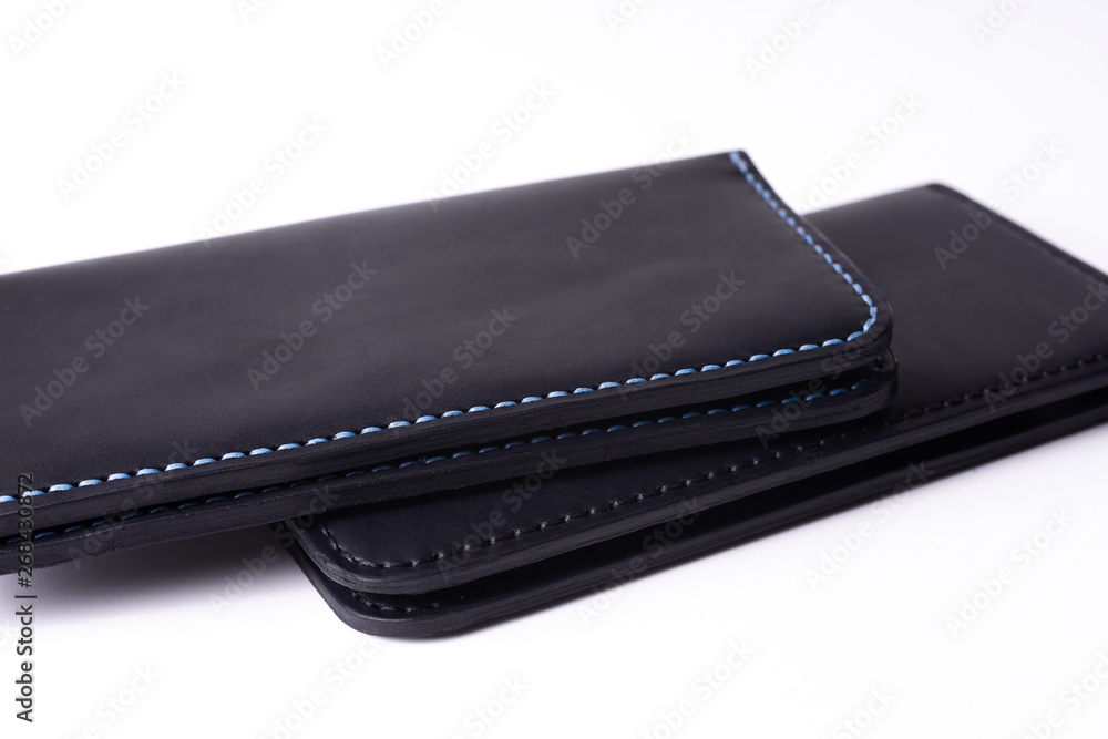 Two handmade leather black purse isolated on white background. Stock photo of luxury accessories. Two handmade leather black purse isolated on white background. Stock photo of luxury accessories.