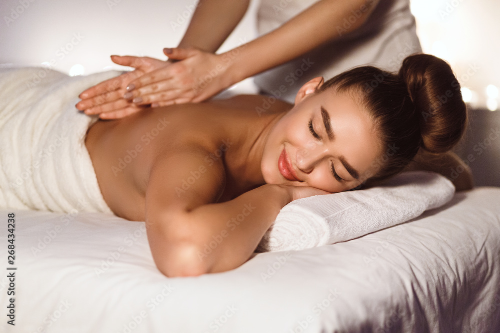 Body Care. Woman Enjoying Back Massage In Spa Body Care. Woman Enjoying Back Massage In Spa