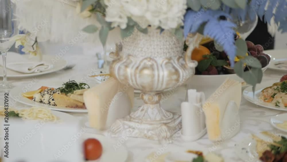 Celebration banquet table with flowers decoration Celebration banquet table with flowers decoration