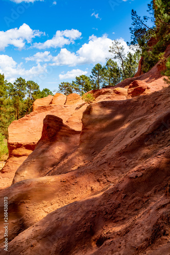 Large colorful ochre deposits, located in Roussillon, small Provensal town in Natural Regional Park of Luberon, South of France