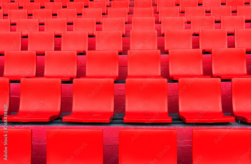 Fototapeta premium rows of red seat pattern in football or soccer sport stadium