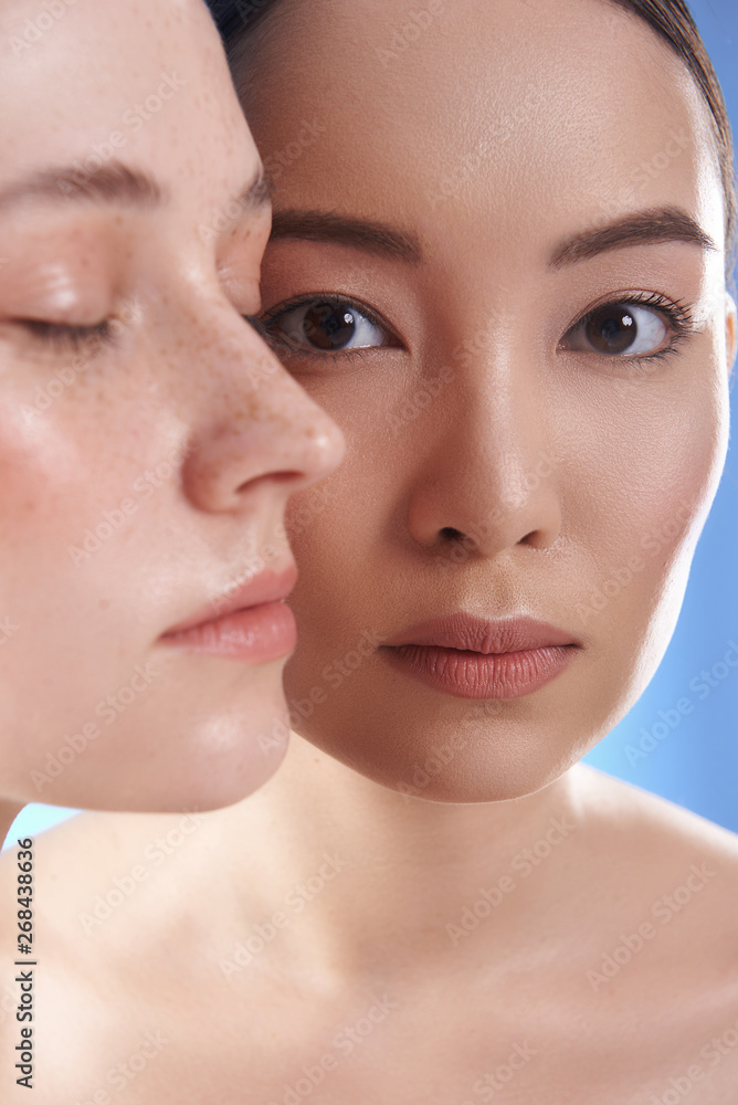 Close up portrait of interracial pretty women with different types of skin Close up portrait of interracial pretty women with different types of skin