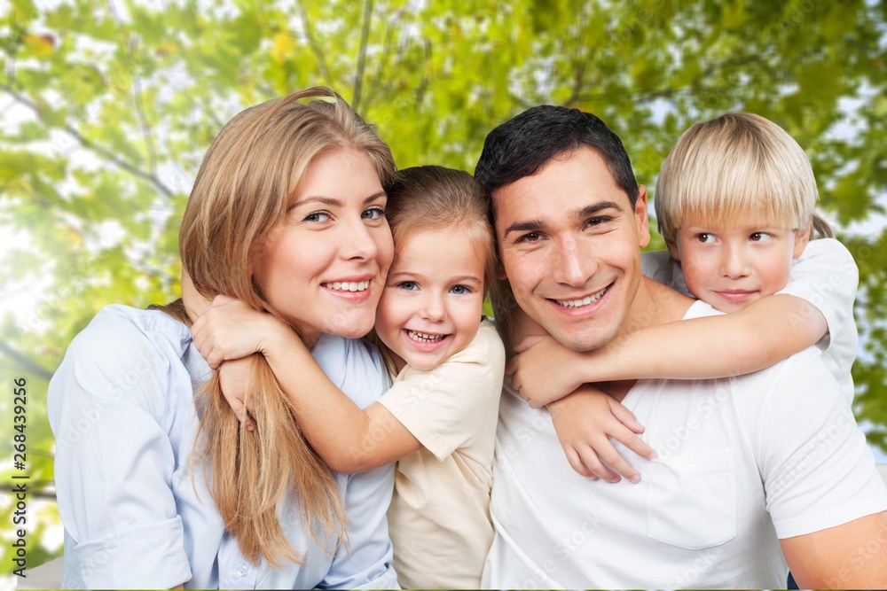 Happy smiling family with daughter over green Happy smiling family with daughter over green