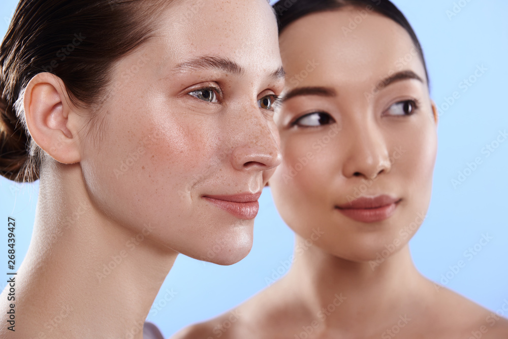Close up of interracial pretty women with different types of skin Close up of interracial pretty women with different types of skin
