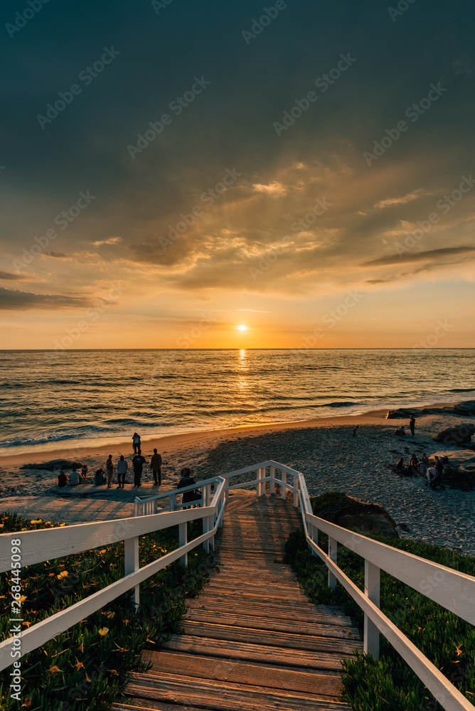 Staircase and view of the Pacific Ocean at sunset, at Windansea Beach, in La Jolla, California