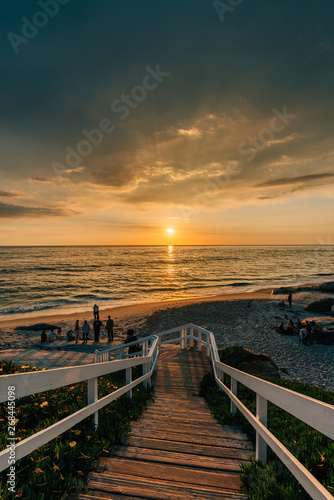 Staircase and view of the Pacific Ocean at sunset, at Windansea Beach, in La Jolla, California