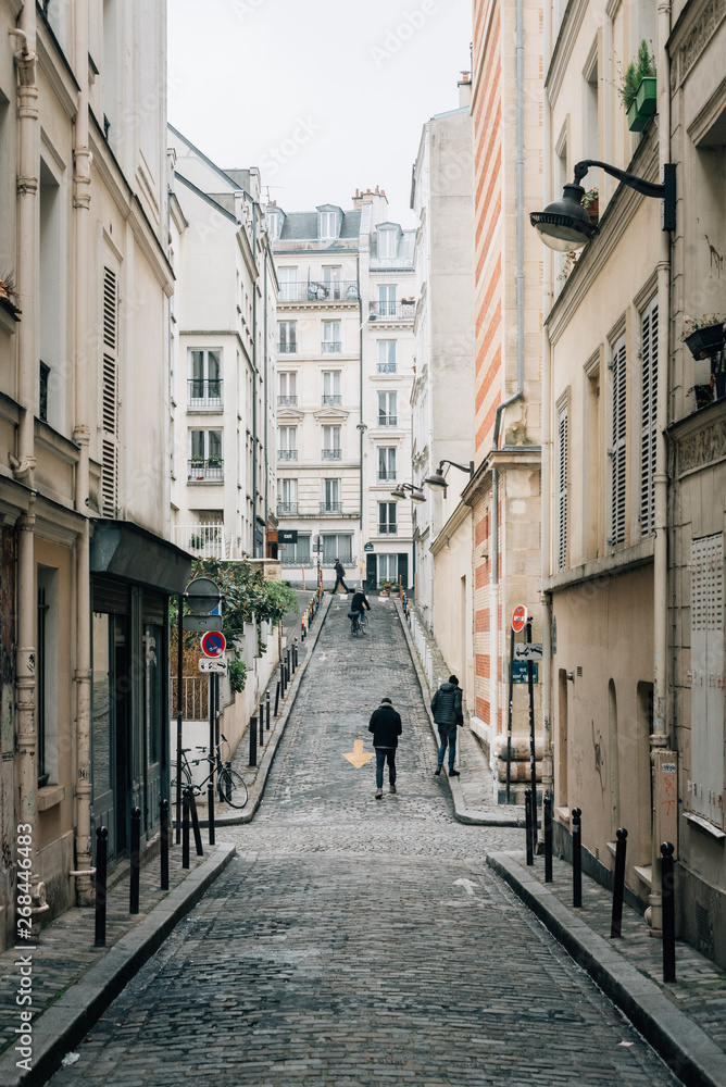 Narrow cobblestone street in Montmartre, Paris, France