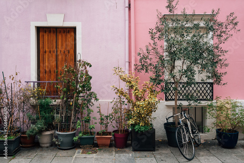 Bike and pink house along Rue Cremieux in Paris, France